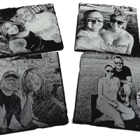 Four engraved slate photo coasters are one of the products available from Primal Soul Boudoir in Rosenberg, Texas.